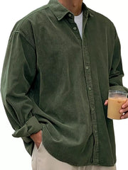 Men's green corduroy button-up shirt with classic collar and long sleeves.