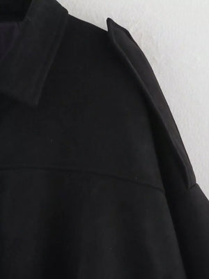 Black oversized zip-up jacket with a collar and shoulder detail