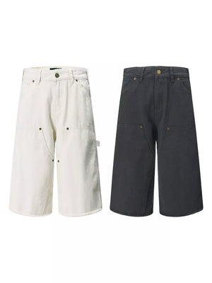 Relaxed fit utility capris in dark gray and apricot with multiple pockets.