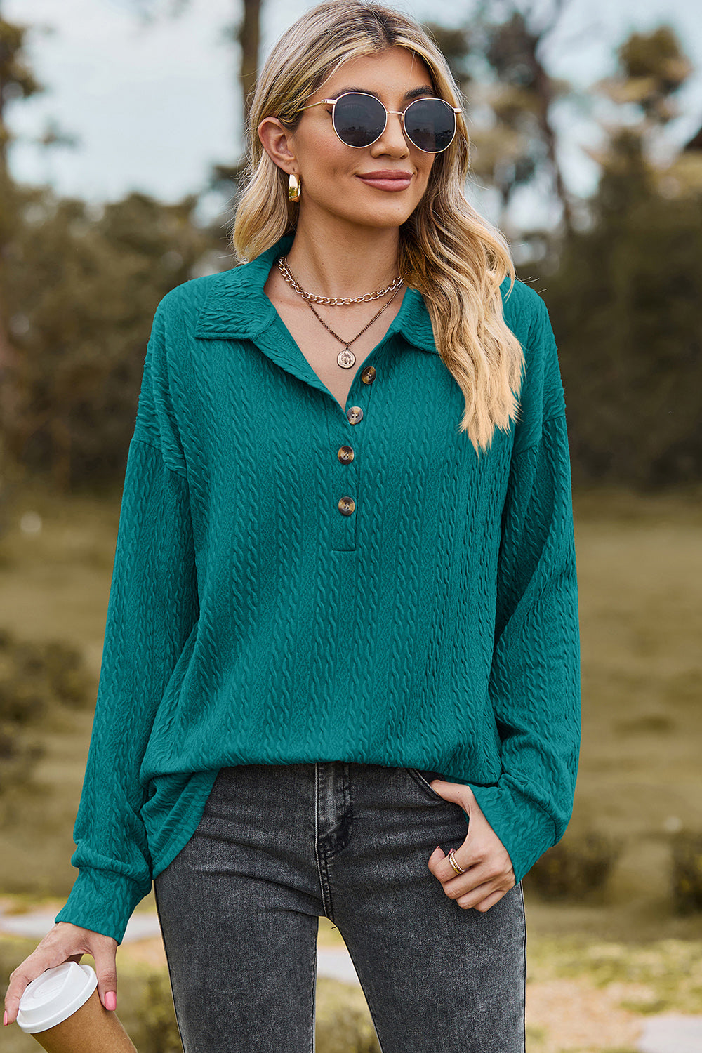 Teal textured polo-neck sweater with button detail and long sleeves.
