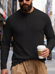 Men's black long sleeve cotton Henley t-shirt with button placket.