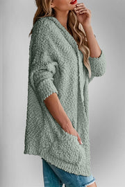 Textured popcorn knit open cardigan in Gum Leaf with pockets and 3/4 sleeves.