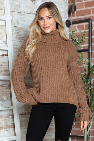 Brown chunky ribbed turtleneck sweater with relaxed fit and long sleeves.