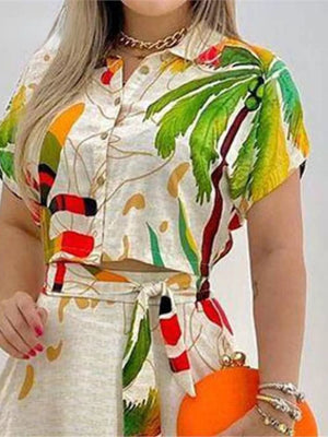 Tropical print crop top and skirt set with button front and tie waist.