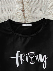 Black graphic tee with white "friday" text and wine glass graphic, crew neck, short sleeve.