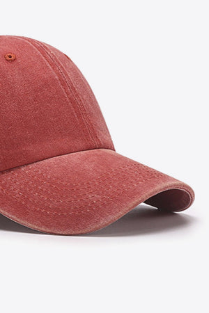 Washed cotton baseball cap in red with stitched details on the brim.