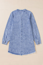 Acid wash denim shirtdress with raw hem and button cuffs.