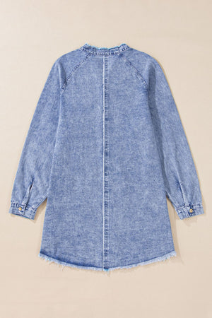 Acid wash denim shirtdress with raw hem and button cuffs.