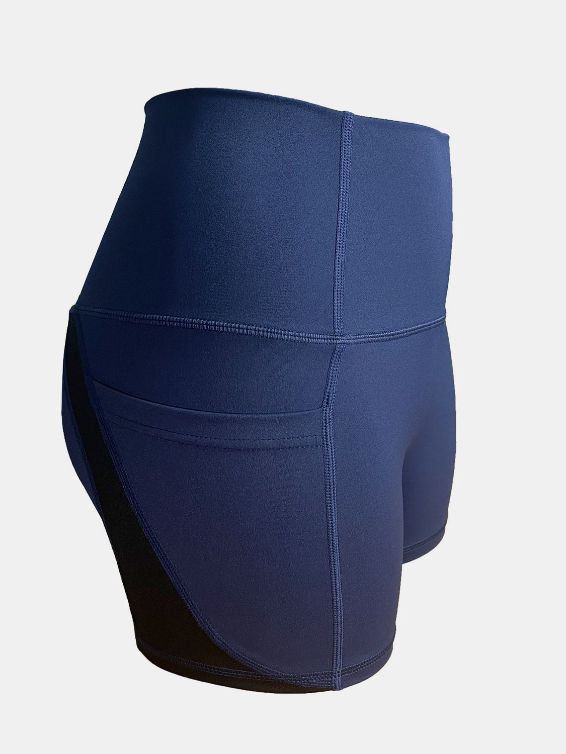 Dark blue activewear shorts with colorblock detail and pocket