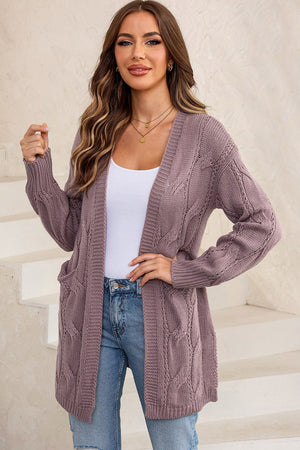 Lilac cable knit open-front cardigan with pockets and ribbed cuffs.