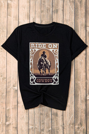 Black graphic t-shirt with a cowboy riding a horse and the words Ride On Cowboy.