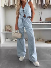 Light blue denim tie-front vest and relaxed wide-leg pants set.