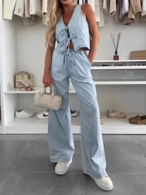 Light blue denim tie-front vest and relaxed wide-leg pants set.