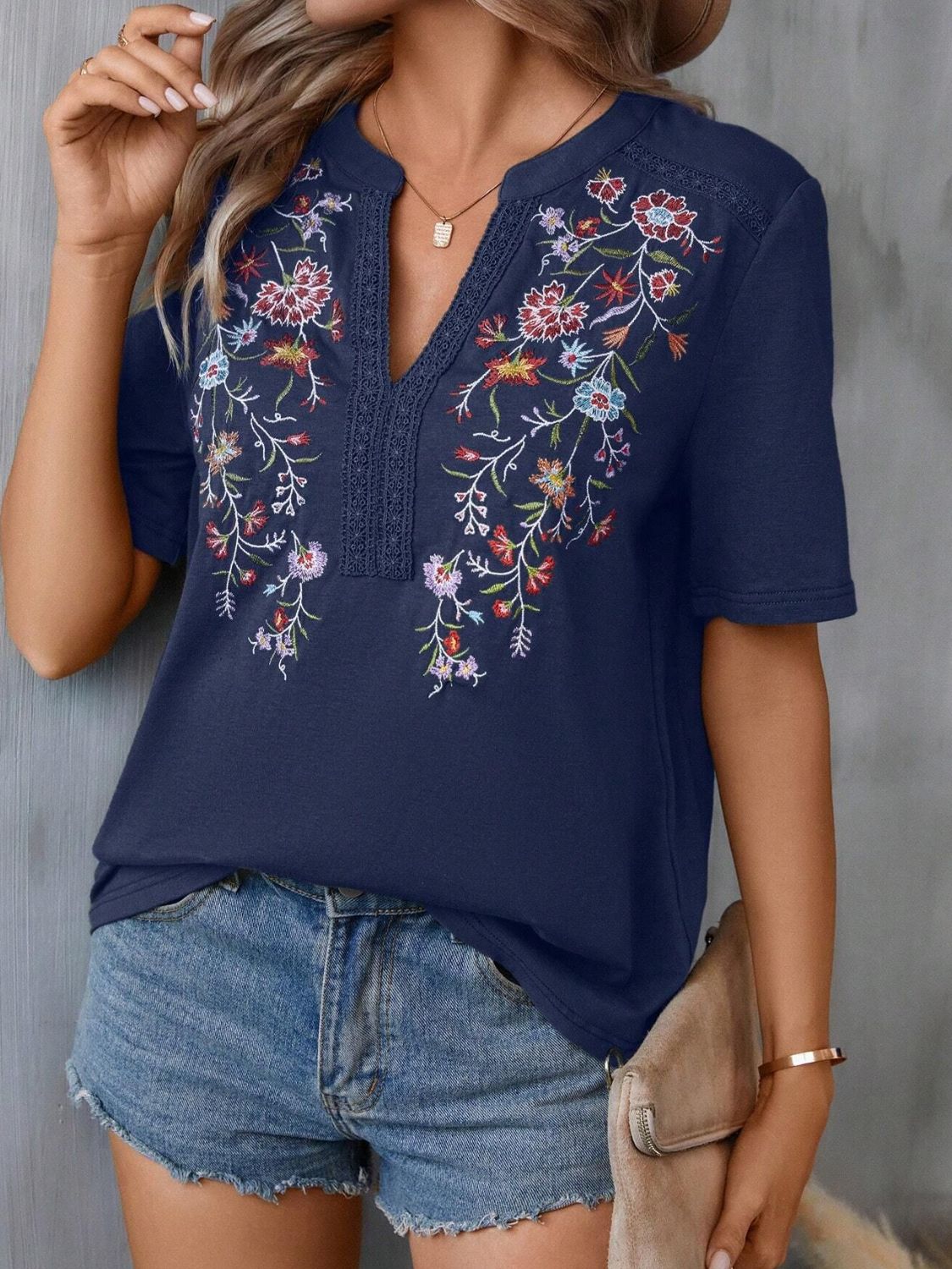 Dark Navy V-neck tee with colorful floral embroidery and crochet trim detail.