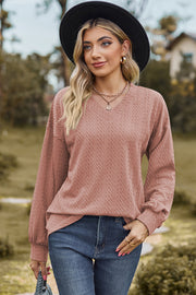 Dusty Pink textured cable knit V-neck pullover sweater with long sleeves.