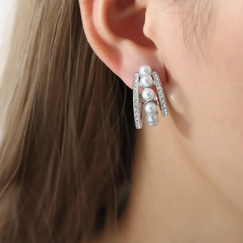 Silver double hoop earrings with pave details and four pearls.