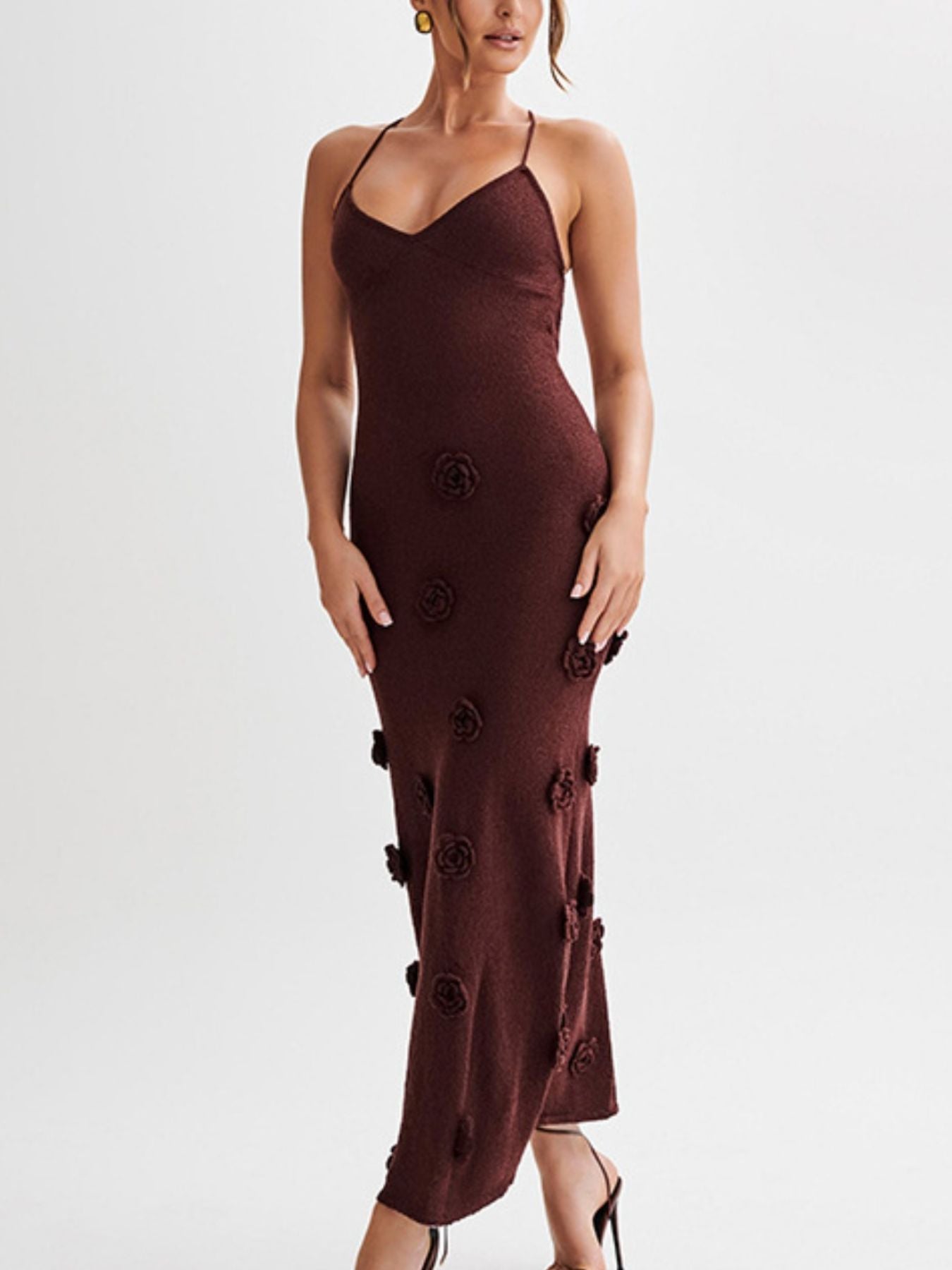 Brown knit maxi dress with 3d floral appliques and a halter neckline.