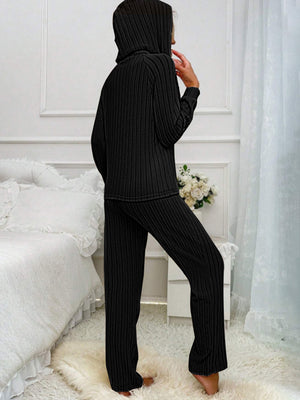 Black ribbed knit hooded loungewear set with long sleeves and pants.