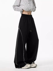 Black wide-leg drawstring sweatpants with contrast stitching detail