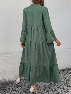 Green tiered ruffle hem midi dress with long bell sleeves and V-neck.