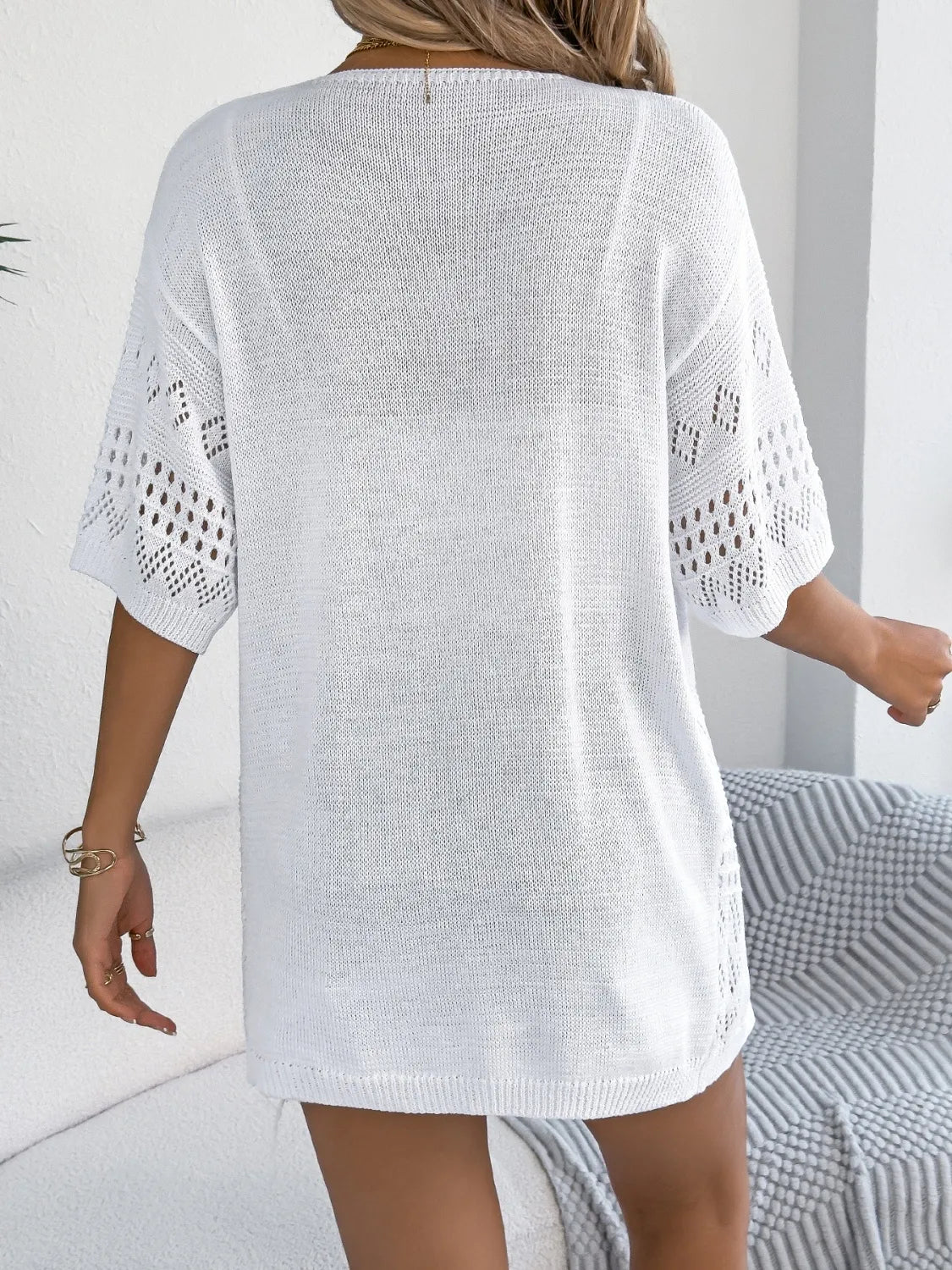 White open-knit short sleeve duster cardigan with diamond pattern detail on sleeves.