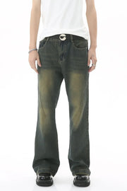 Faded wash flare denim jeans in dark with subtle whiskering and seam detail.