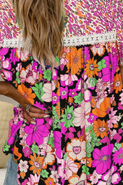 Floral patchwork blouse with puff sleeves and lace trim in vibrant colors.