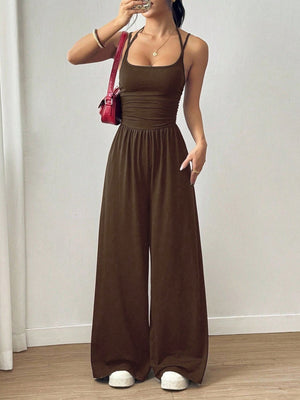 Coffee brown wide-leg jumpsuit with ruched waist and spaghetti straps.