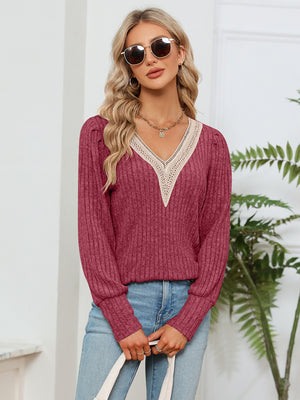 Brick Red ribbed knit sweater with crochet V-neck trim and long sleeves.