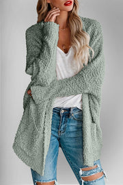 Textured popcorn knit open cardigan in Gum Leaf green with long sleeves and pockets.