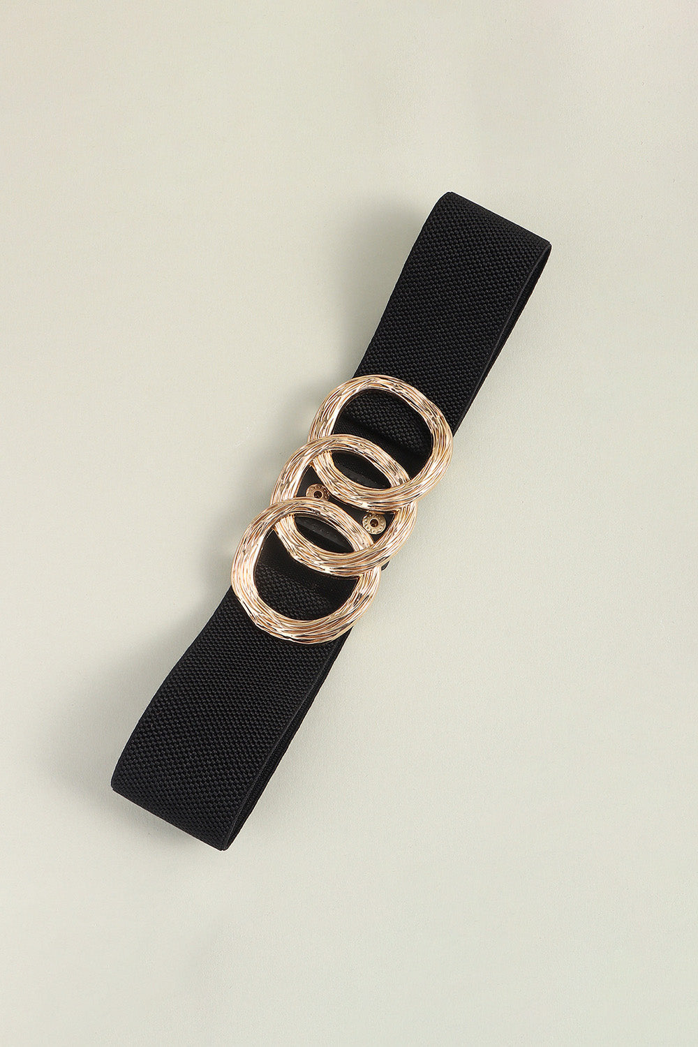 Black elastic belt with triple gold interlocking rings buckle