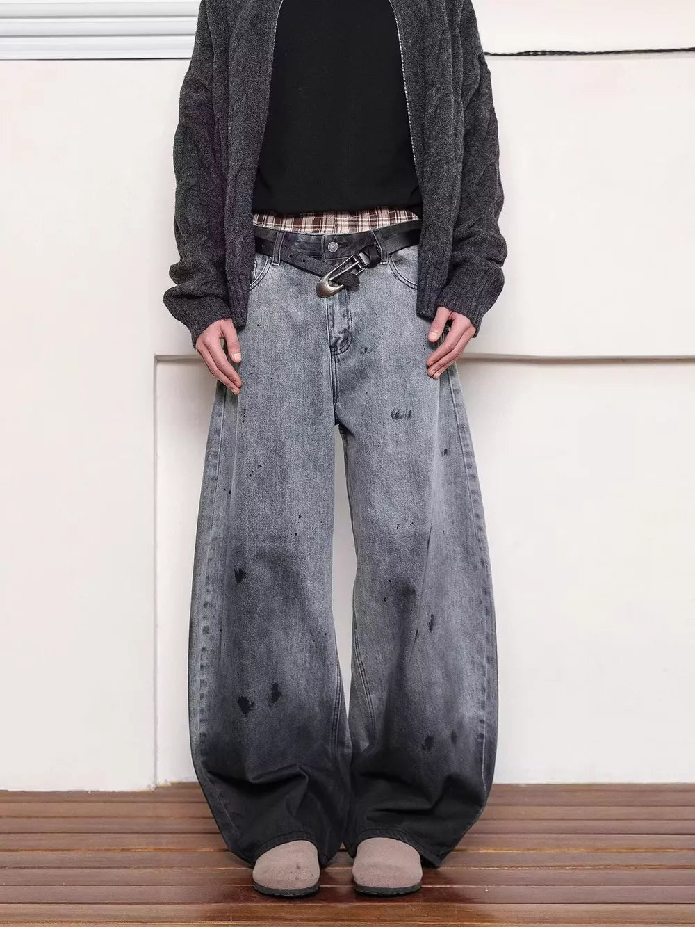 Men's washed wide leg jeans in grey with distressed details and a gradient effect.