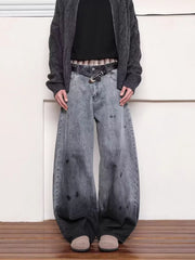 Men's washed wide leg jeans in grey with distressed details and a gradient effect.