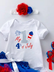 White baby onesie with "My 1st 4th of July" patriotic graphic and matching headband.