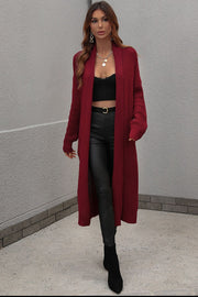 Textured knit maxi cardigan in wine with an open front and long sleeves.