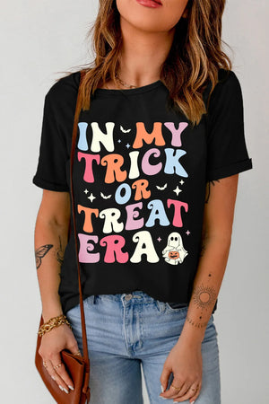 Black graphic t-shirt with colorful "IN MY TRICK OR TREAT ERA" text and Halloween graphics.