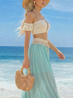Crochet bandeau top and pastel blue maxi skirt with lace trim detail.