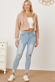 Waffle knit cropped zip hoodie in khaki with drawstring hood and cuffed sleeves.