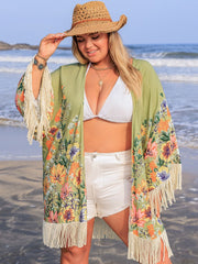 Sage floral print kimono cover-up with fringe details and wide sleeves.