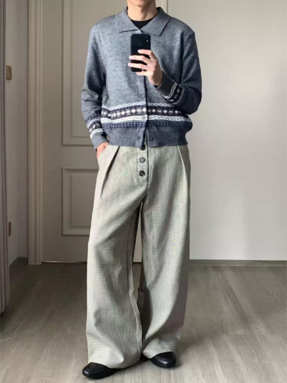 Men's grey plaid wide leg sweatpants with button fly and pockets.