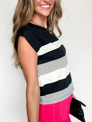 Chic black and white striped cap sleeve t-shirt with crew neck.