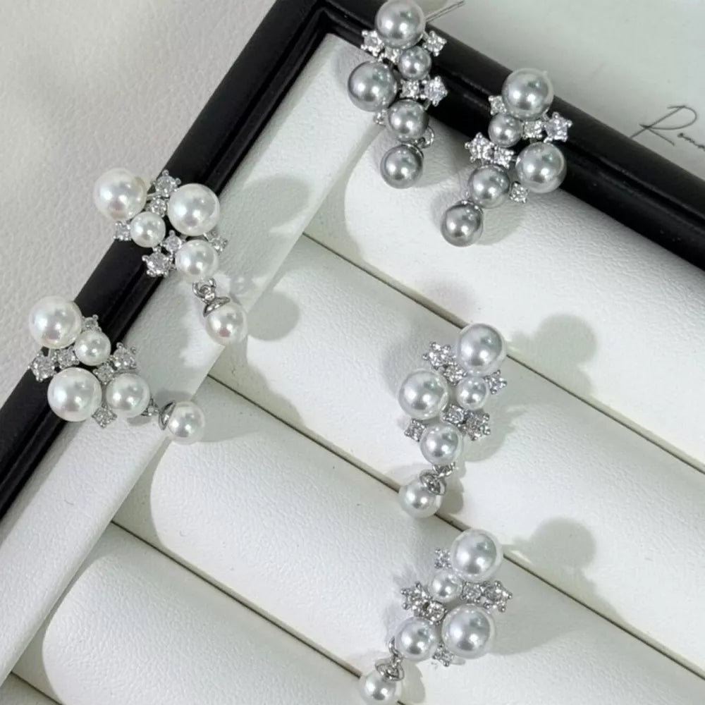 Sophisticated pearl and zircon cluster earrings in light gray and white.