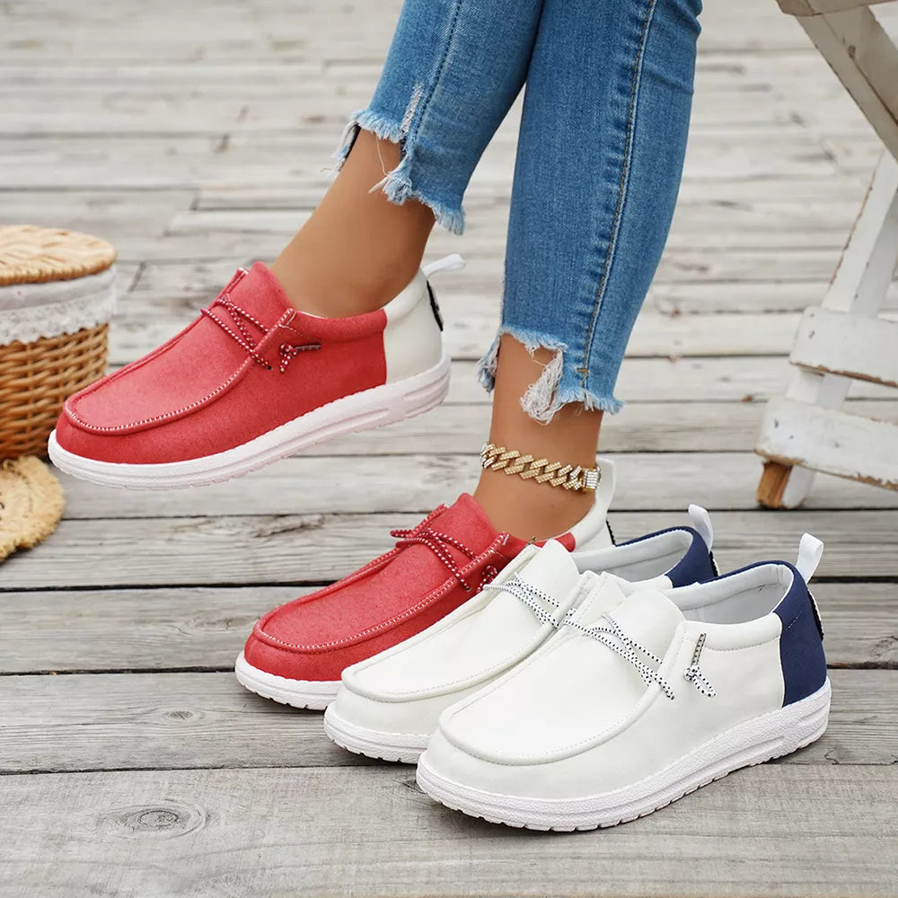 Chic two-tone casual slip-on shoes in red and white, and white with navy accents.