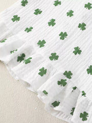 White cotton baby set with green shamrock print and ruffled trim.