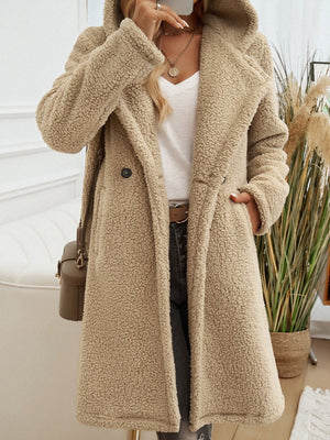 Camel teddy hooded cocoon coat with double-breasted closure and lapel collar.