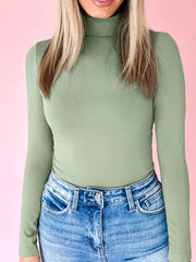 Sage stretchy long-sleeve turtleneck tunic with a high neckline.