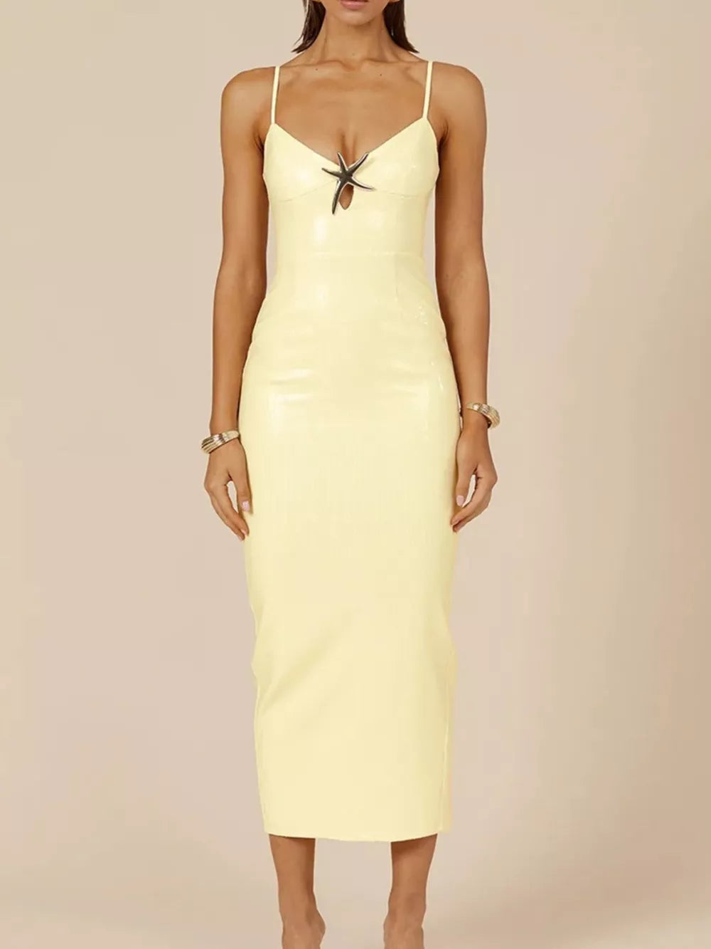 Sequined cami dress in apricot with a cutout detail and a slit.