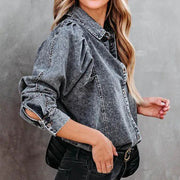 Dark gray acid-washed denim shirt with puffed sleeves and button cuffs.
