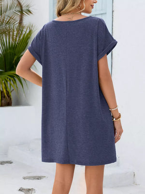 Dusty blue v-neck pocket dress with cuffed short sleeves and a relaxed fit.