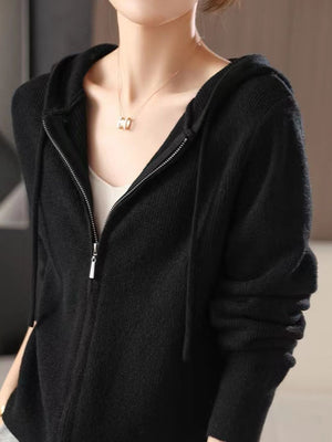 Black ribbed knit zip-through hoodie with a full zip closure and hood.